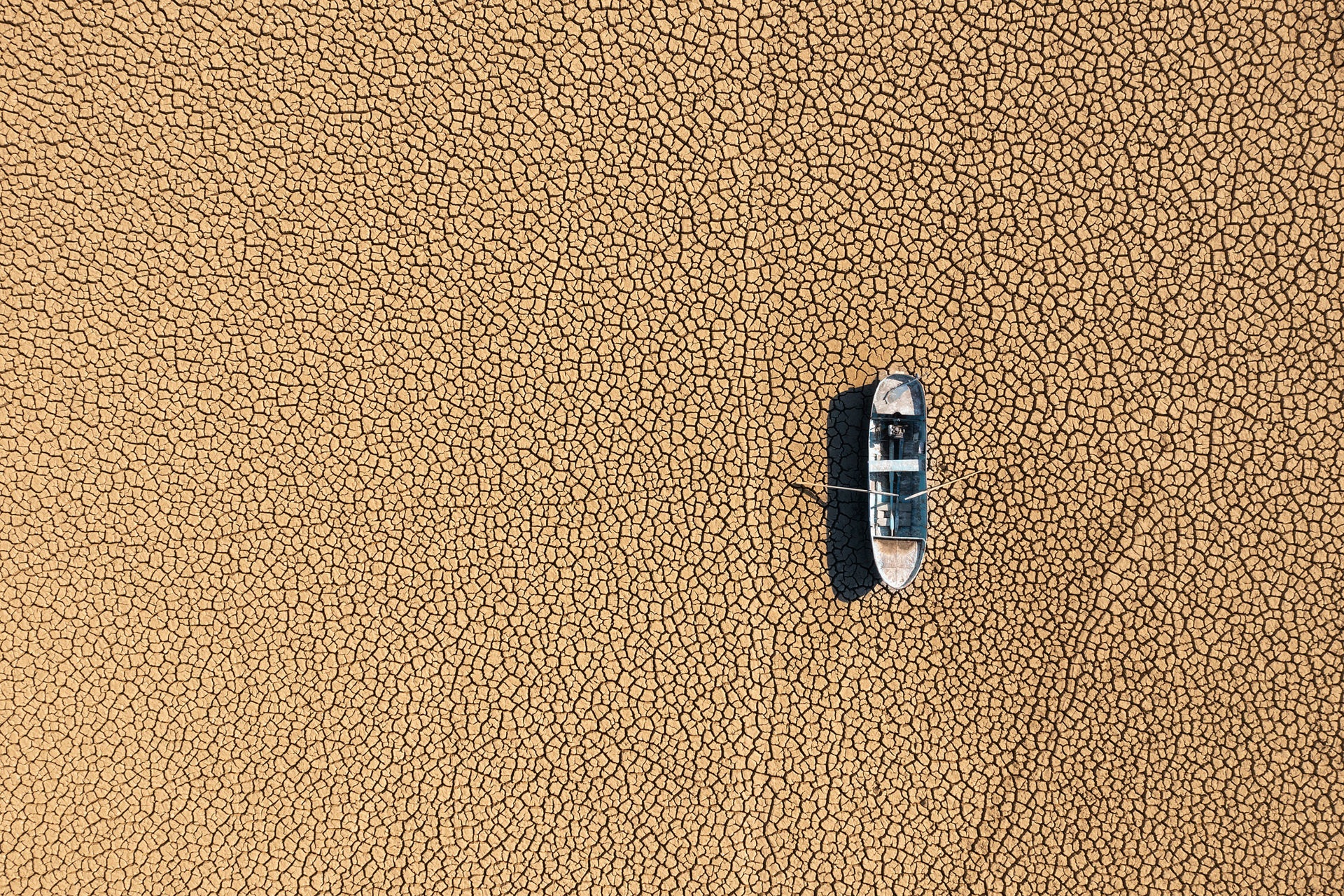 Boat strande on a dried-out lake