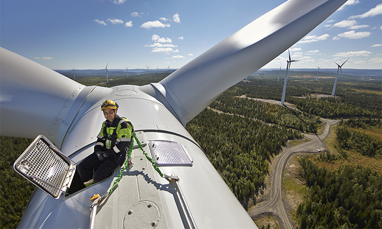 Statkraft employee on top of a wind turbine