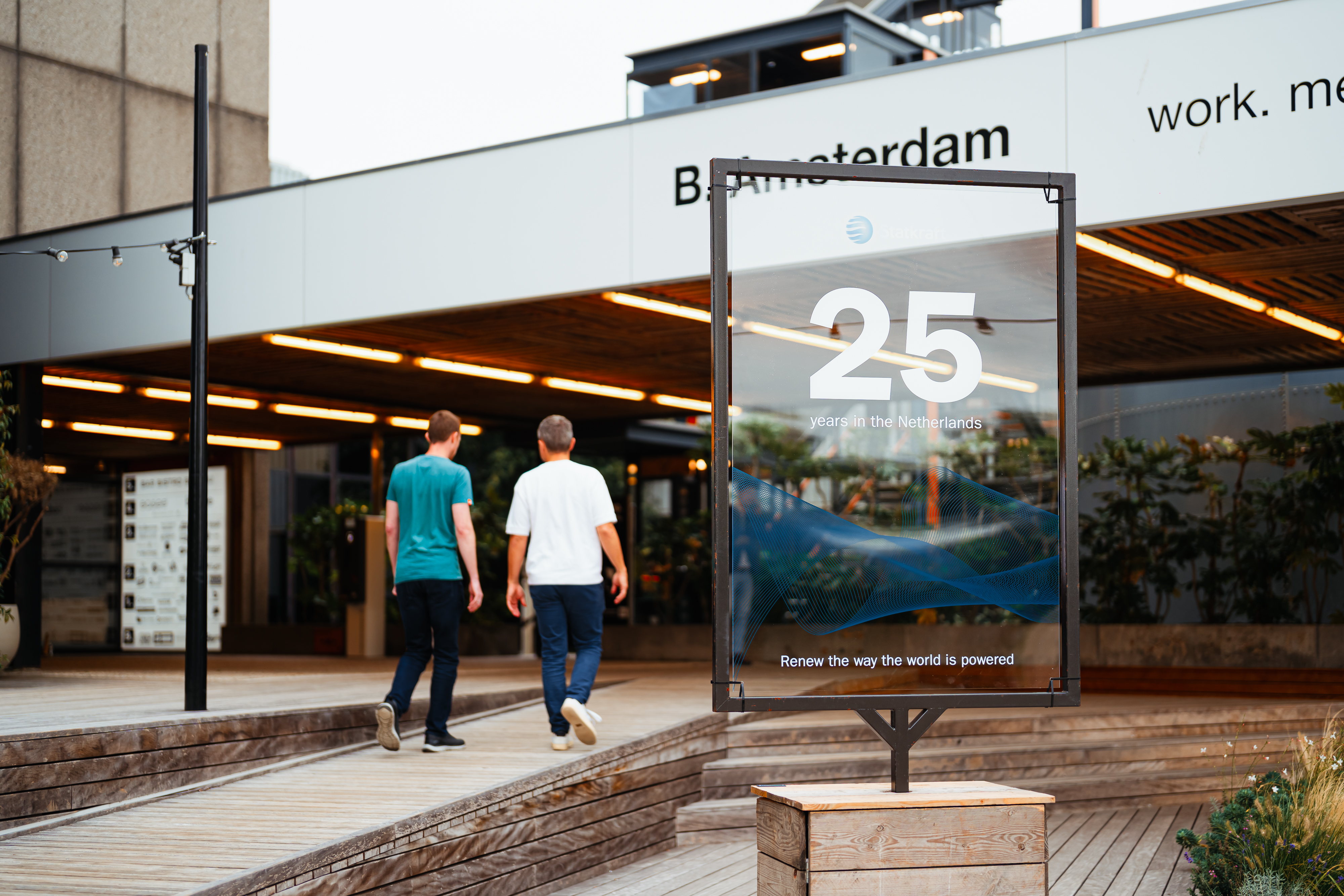 Two men walking into a building